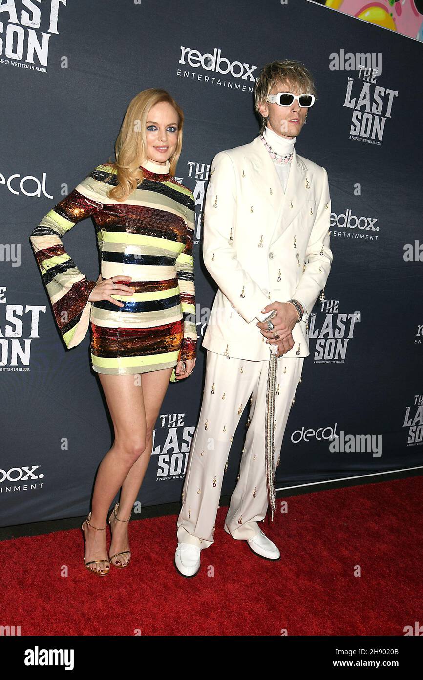 Colson Baker AKA Machine Gun Kelly & Heather Graham in Alice and Olivia stripped dress attends the Redbox Entertainment Screening of 'The Last Son' at IPIC Theaters Fulton Market on Thursday December 2, 2021 in New York, New York, USA. Robin Platzer/ Twin Images/ Credit: Sipa USA/Alamy Live News Stock Photo