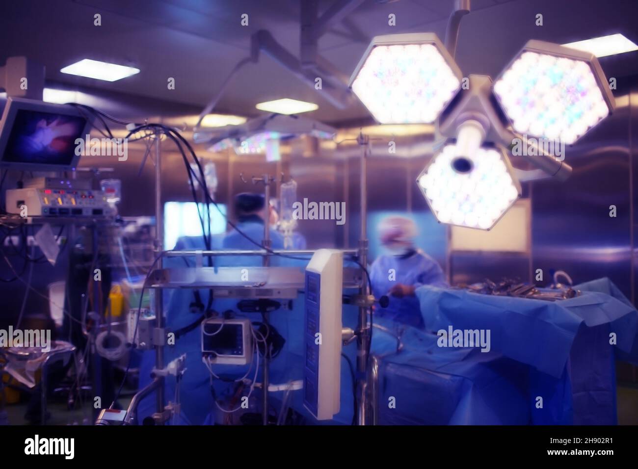 Operating room with working doctor's team during surgical procedure