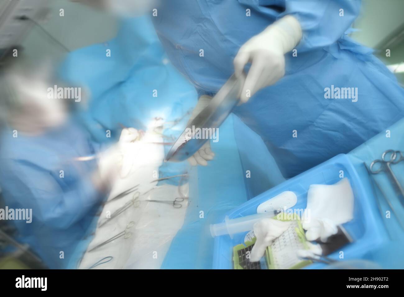 Working surgeons during emergency operating process, unfocused background. Stock Photo