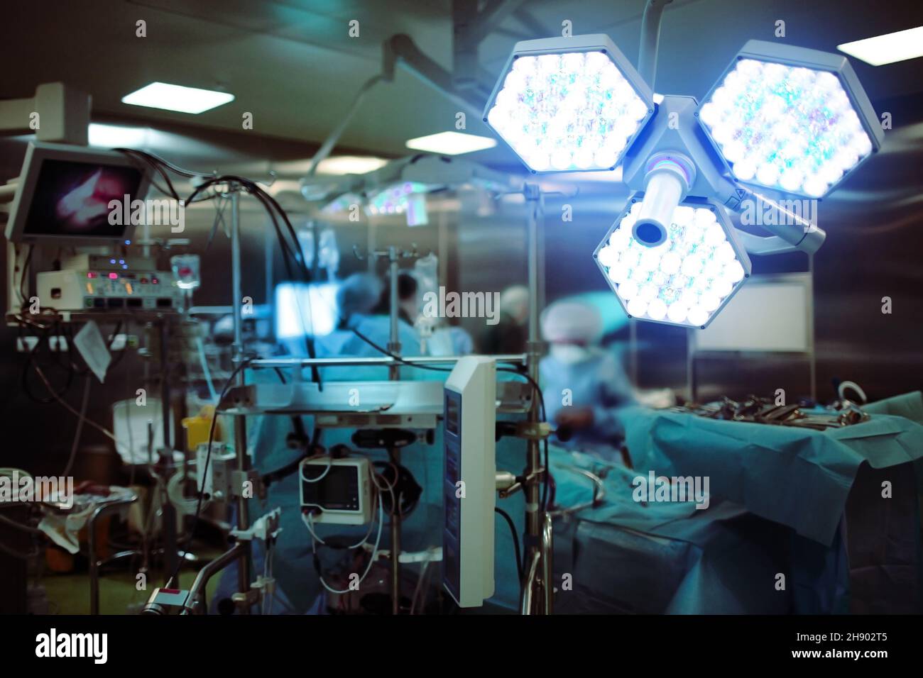 Warm work of surgeons in the operating room among the electronic equipment. Stock Photo