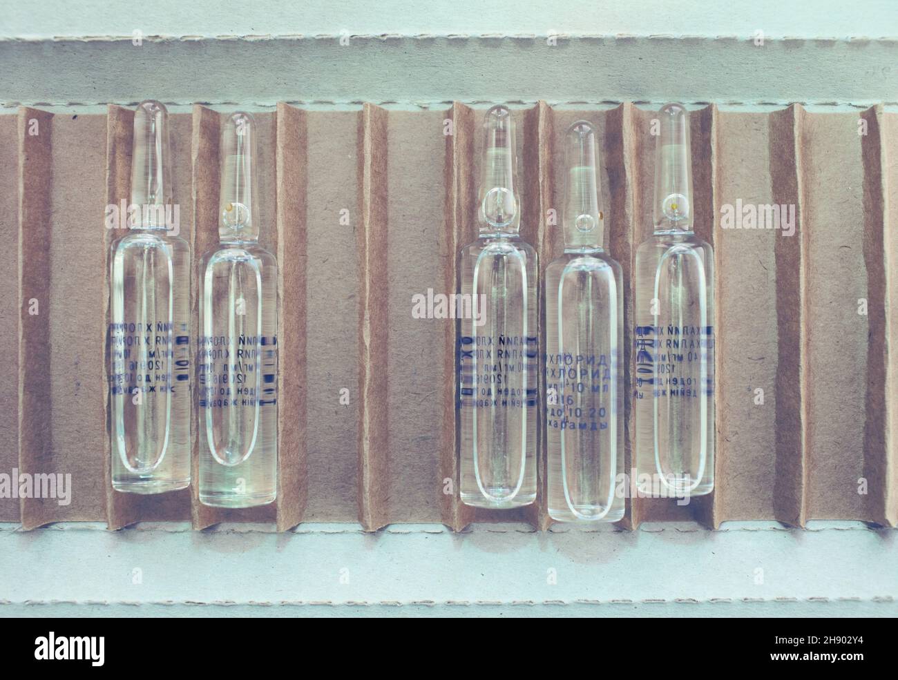 Open cardboard packing box with drug ampoules Stock Photo Alamy