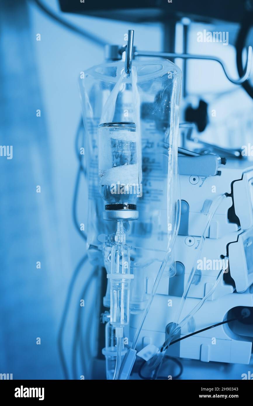 Iv dripping system with the perfusion devices in the night ward. Stock Photo