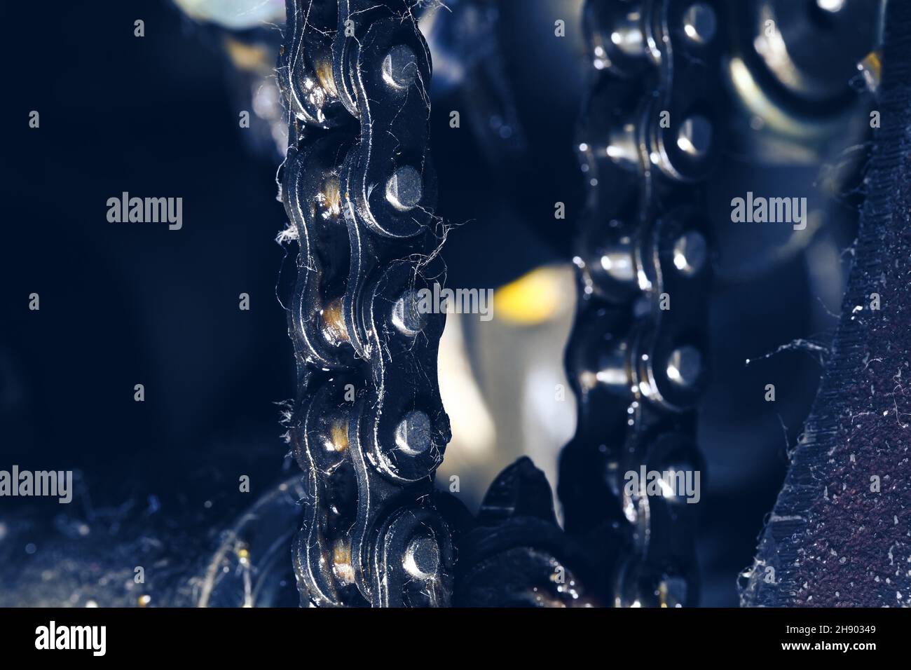 Dusty chain and the chainwheel close-up as a part of machinery. Stock Photo