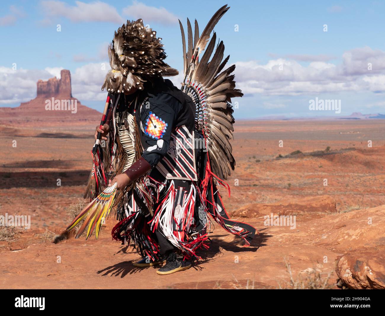 Native American Pow Wow Dancer Dancing In Full Regalia With Feather Native American Pow Wow Dancer Dancing In Full Regalia With Feather