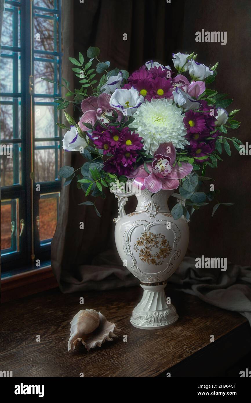 Still life with a luxurious bouquet in an antique vase Stock Photo - Alamy