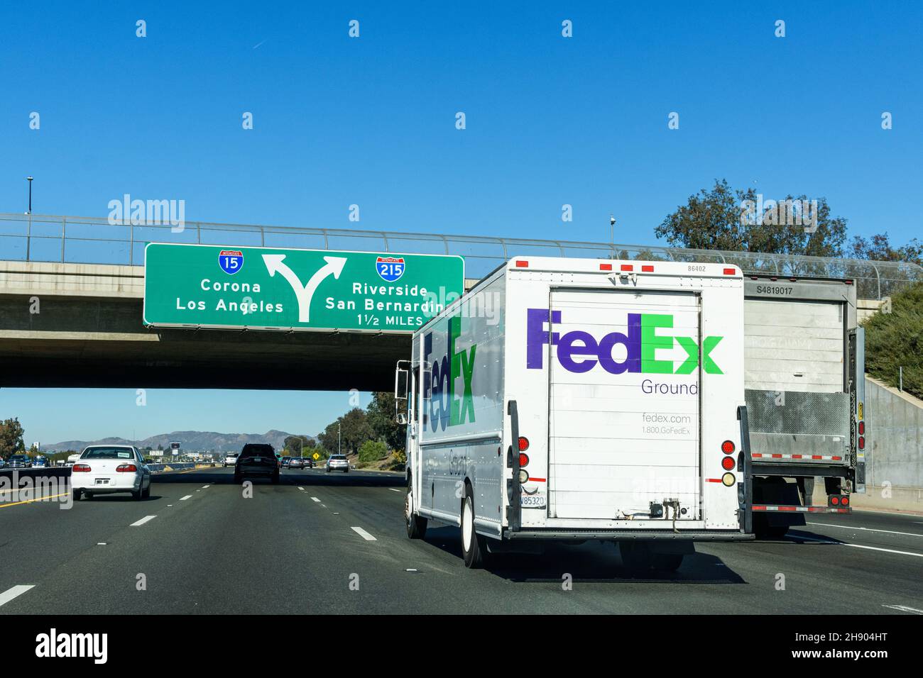 FedEx Ground delivery vehicle is running on highway - Los Angeles, California, USA - 2021 Stock Photo