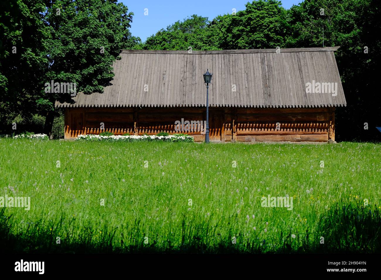 A wodden old house and green fiel. High quality photo Stock Photo