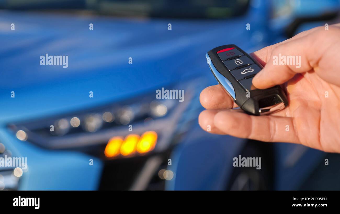 Remote Key Signal Man removes signalling from automobile using remote key Stock Photo - Alamy