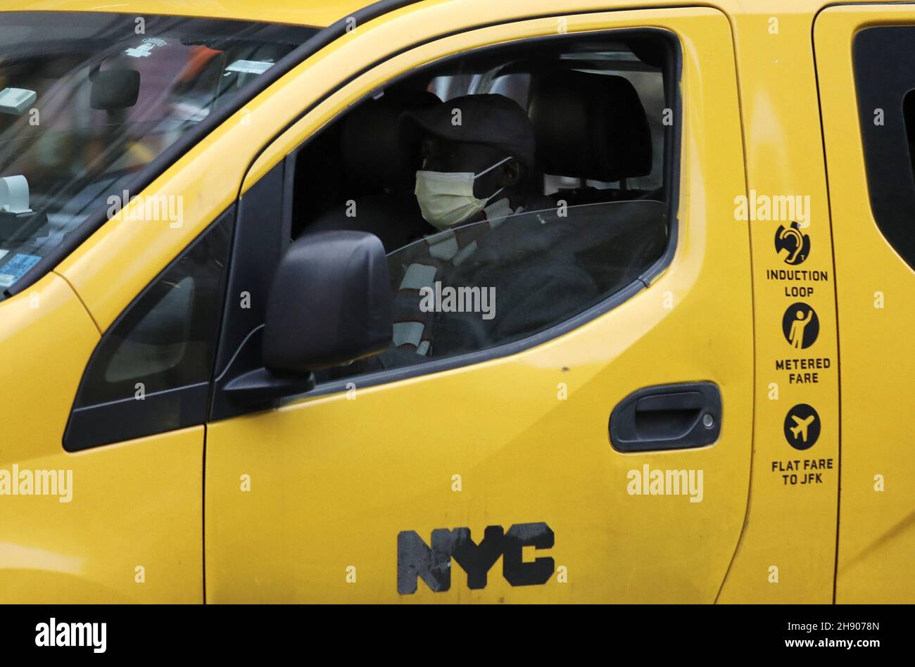 New York, United States. 02nd Dec, 2021. A taxi driver wears a protective face mask inside his cab on Fifth Avenue in New York City on Thursday, December 2, 2021. Health Officials have confirmed 5 cases of Omicron variant detected in New York City. Photo by Peter Foley/UPI Credit: UPI/Alamy Live News Stock Photo