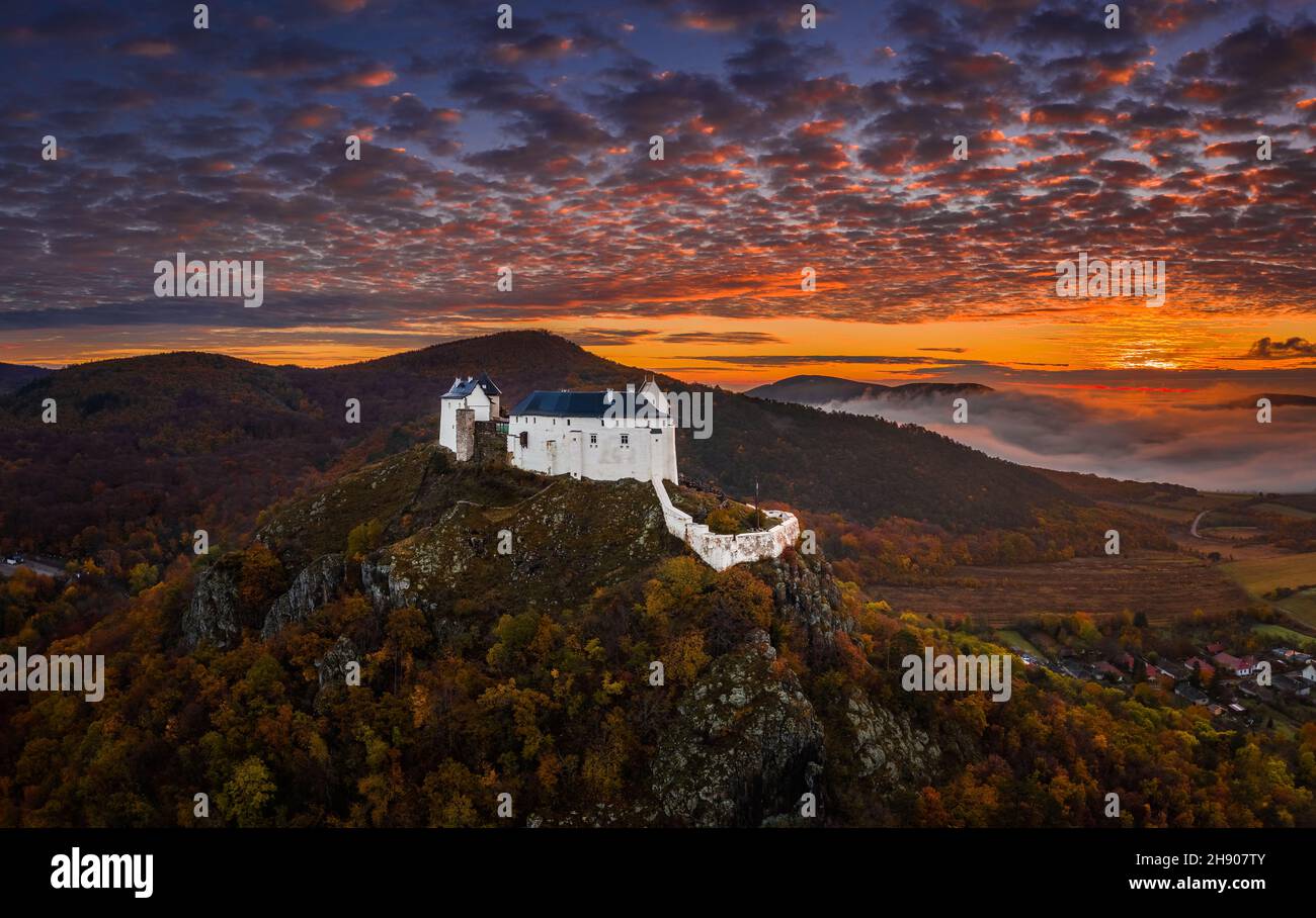 Fuzer, Hungary - Aerial view of the beautiful Castle of Fuzer (Fuzeri var) with amazing colorful foggy sunrise sky and clouds on an autumn morning. Th Stock Photo