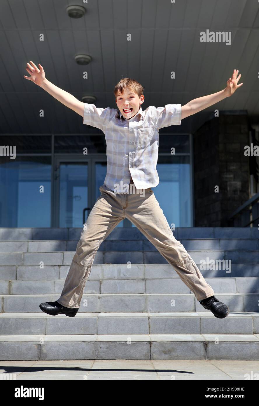 Happy Teenager Jumping on the Landing Steps Stock Photo Alamy