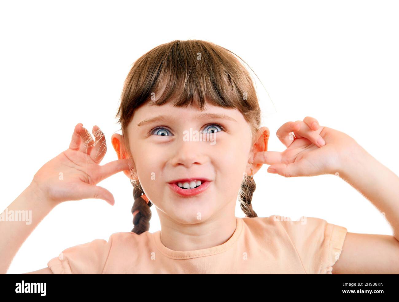 Cheerful Little Girl close the Ears Isolated on the White Background ...