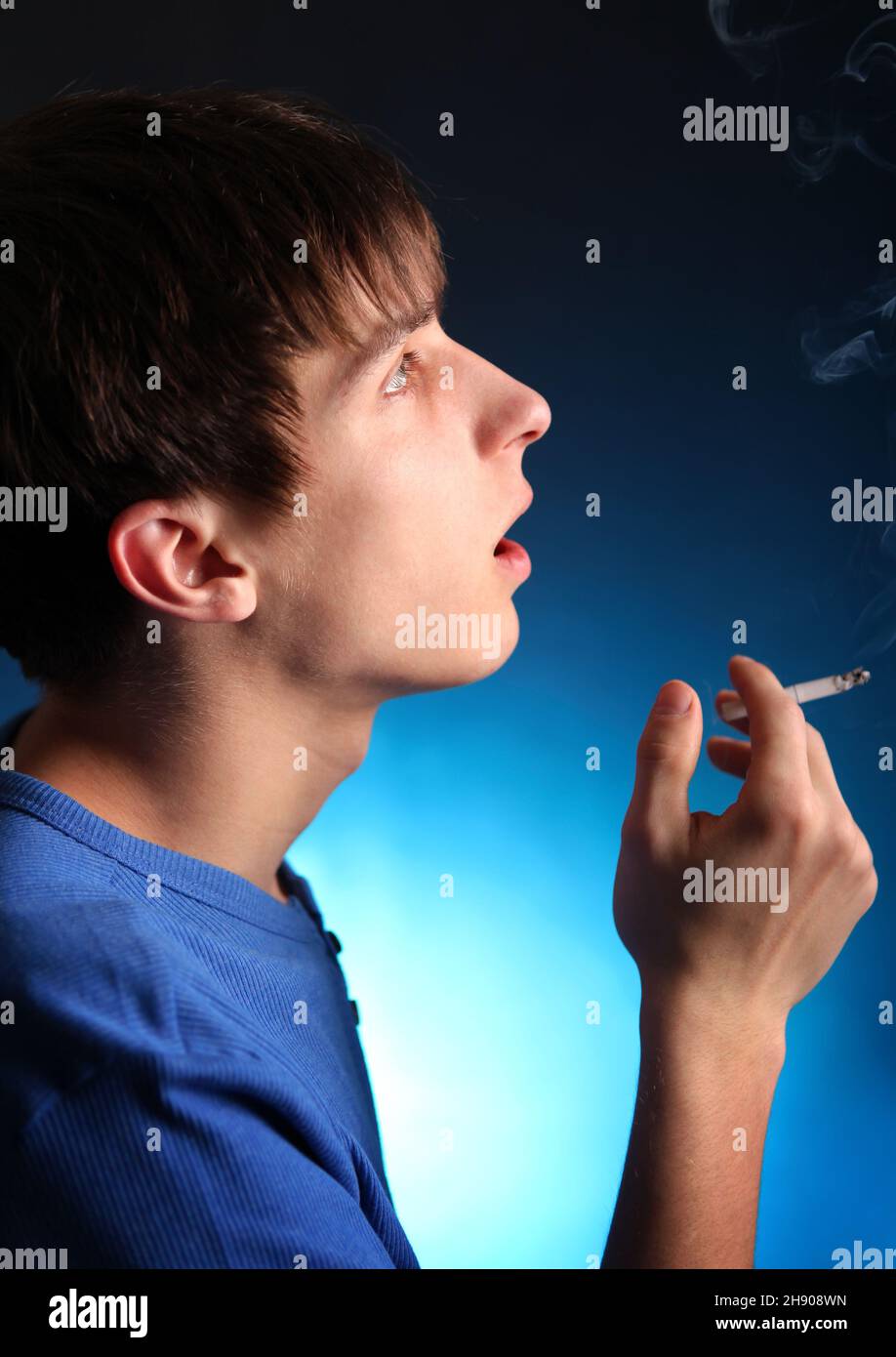 cigarette in dark room Royalty-Free photo: Man holding lighter inside Download free A Person Is