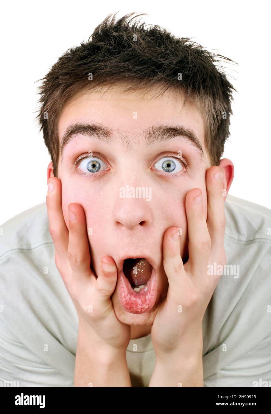 Extremely Surprised Young Man on the White Background closeup Stock Photo
