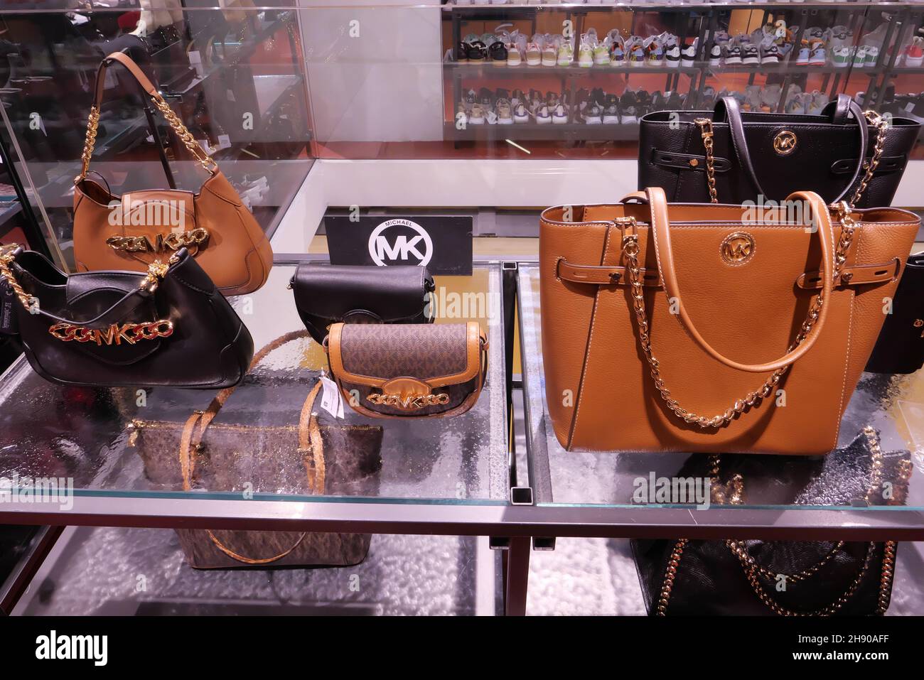 MICHAEL KORS BAGS ON DISPLAY INSIDE THE FASHION STORE Stock Photo