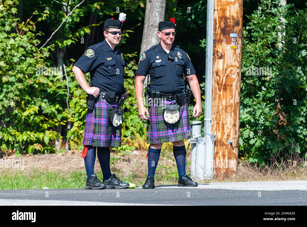 Lincoln, New Hampshire, United States of America – September 17, 2016. Two police officers wearing a Scottish kilt in Lincoln, NH. Stock Photo