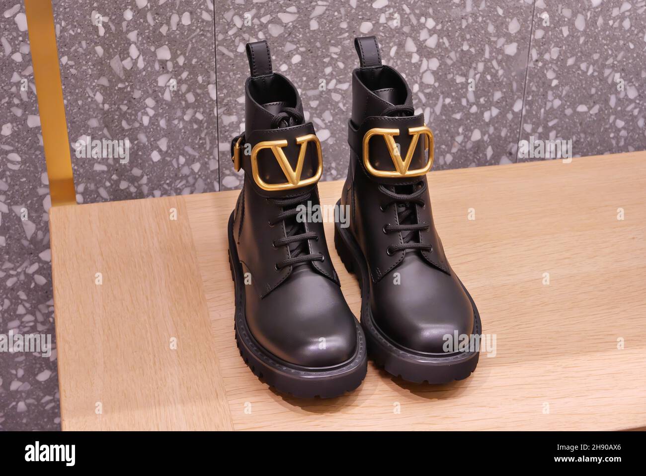 VALENTINO BOOTS ON DISPLAY INSIDE THE FASHION STORE Stock Photo