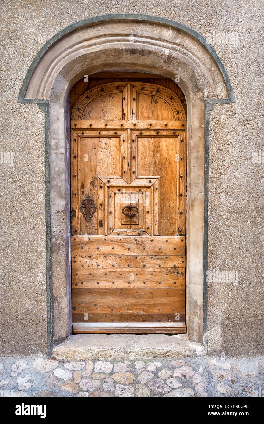 ancient medieval door facade, southern France Stock Photo