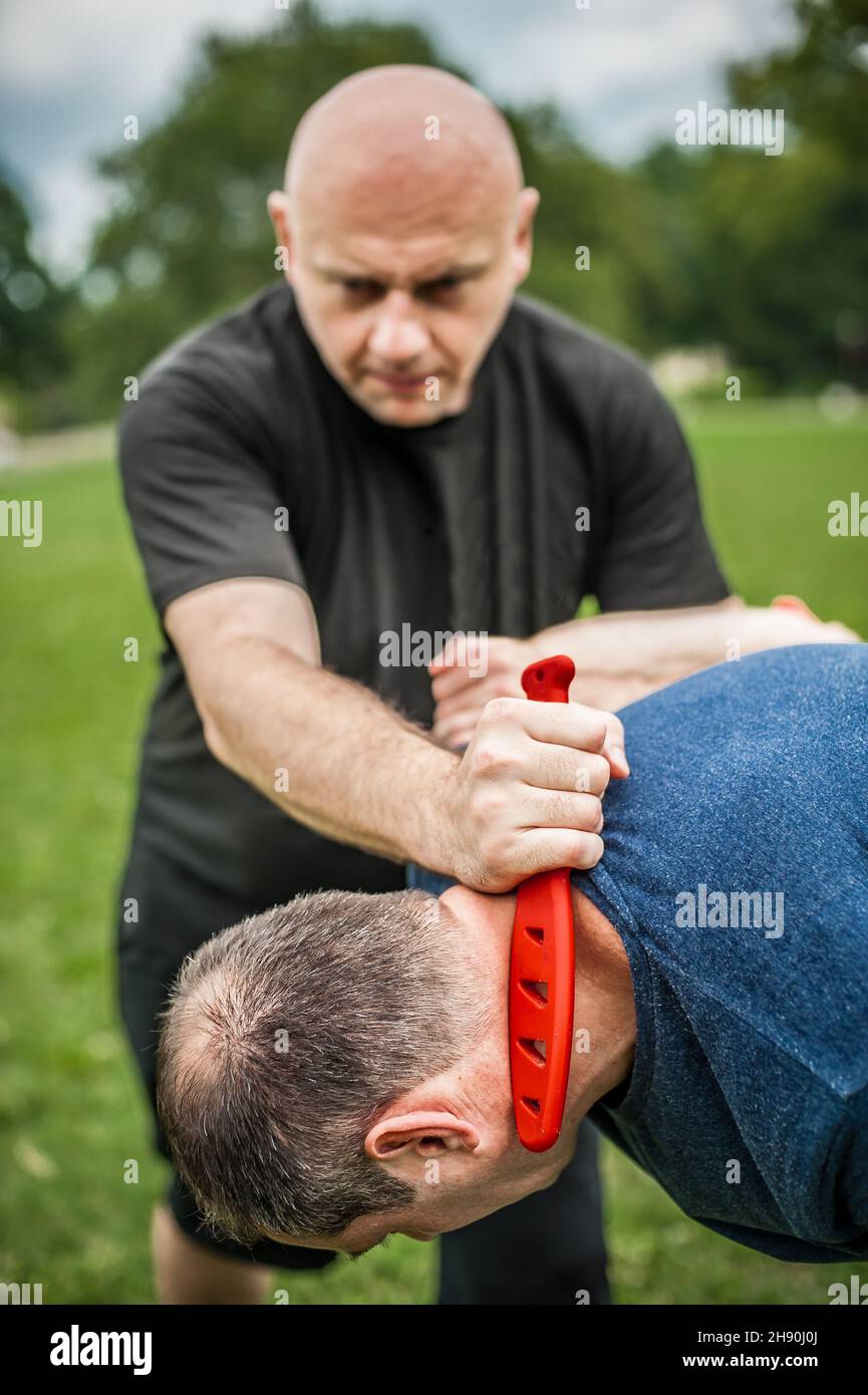 Knife vs knife fight. Kapap instructor demonstrates martial arts self