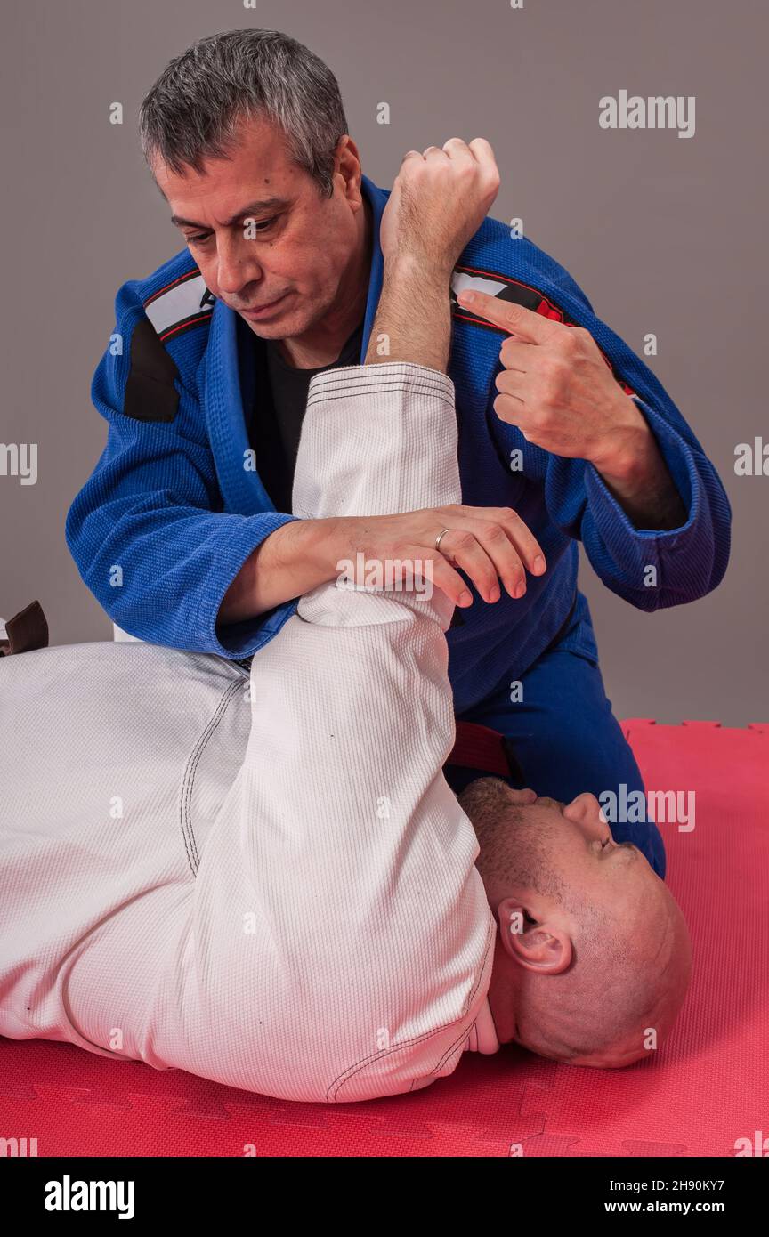 Kapap and brazilian jiu jitsu instructor in traditional kimono