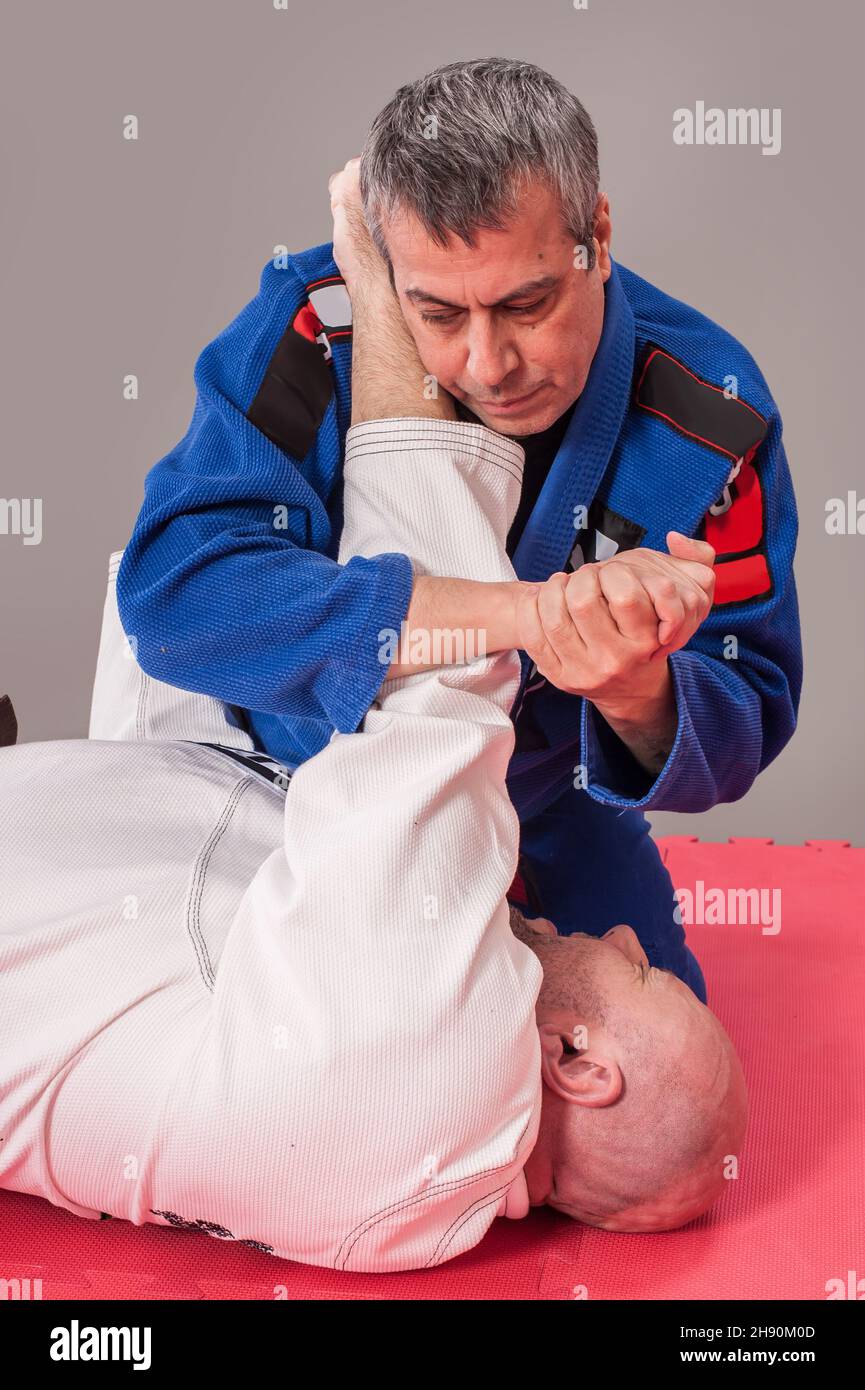 Kapap and brazilian jiu jitsu instructor in traditional kimono