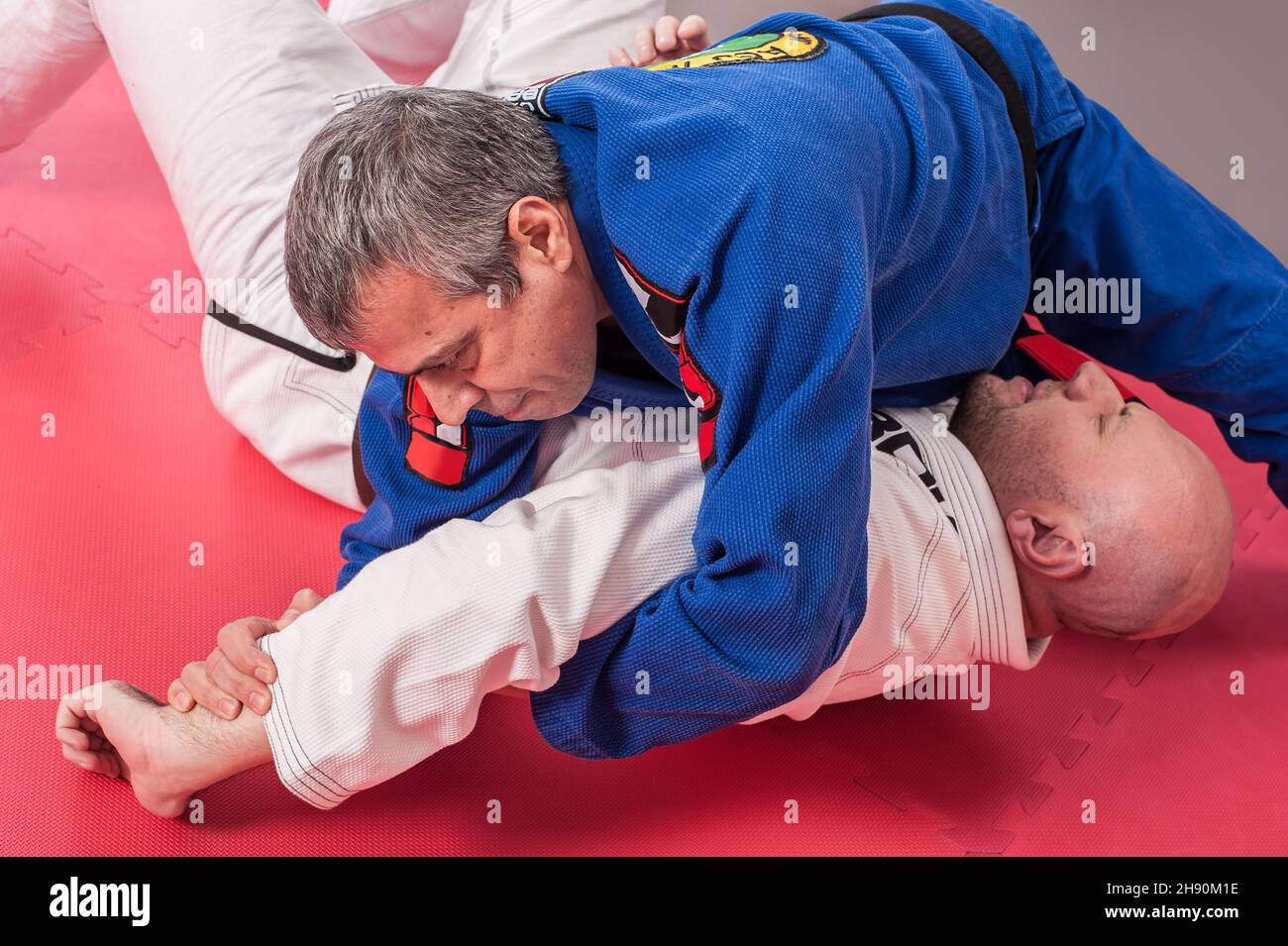 Kapap and brazilian jiu jitsu instructor in traditional kimono