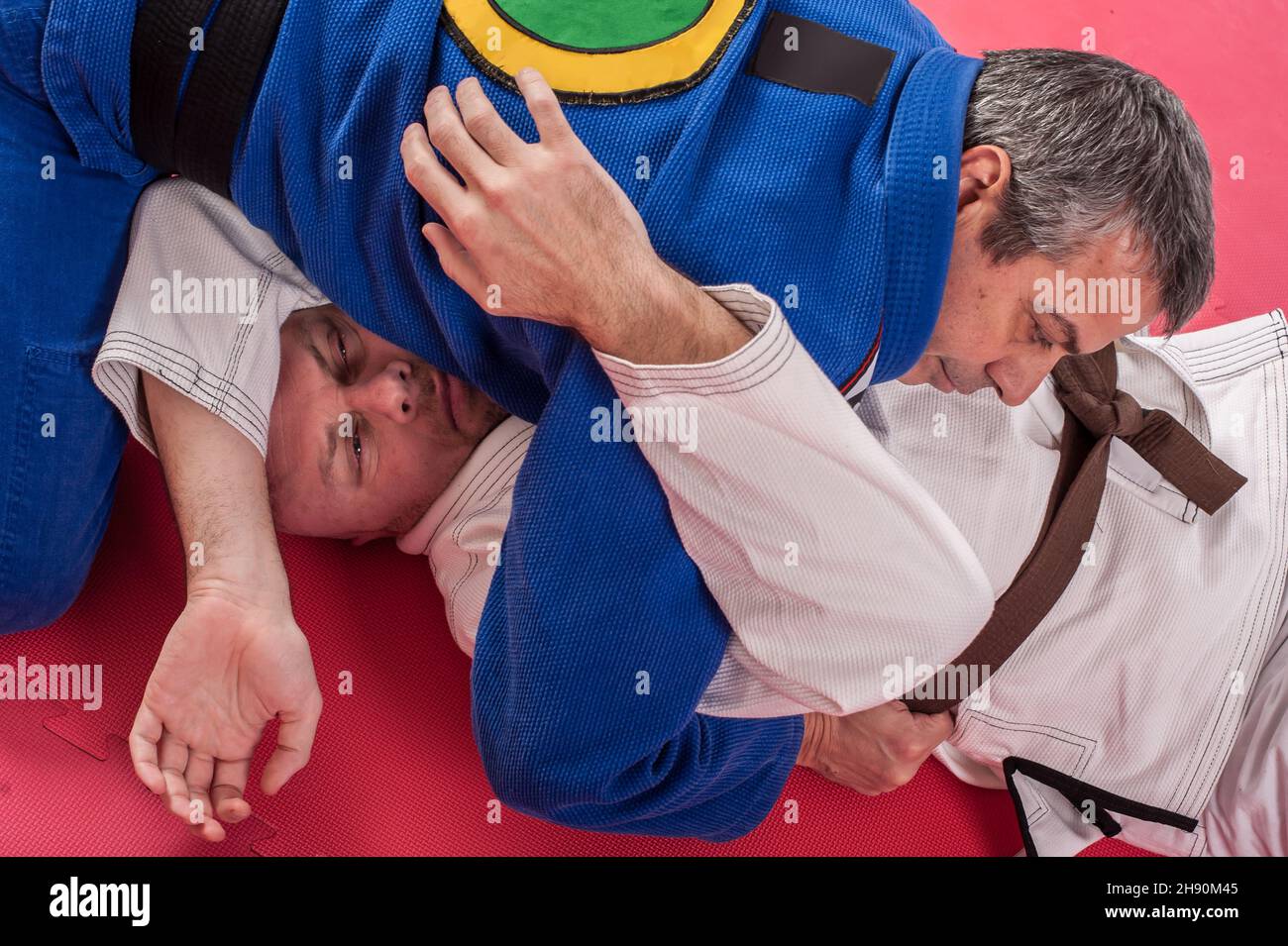 Kapap and brazilian jiu jitsu instructor in traditional kimono