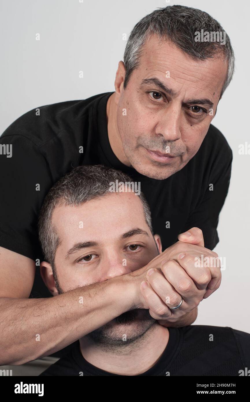 Kapap instructor demonstrates choke techniques with his student Stock