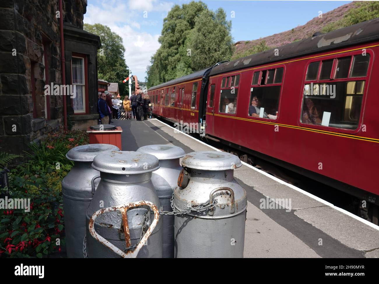 GOATHLAND, UNITED KINGDOM - Aug 16, 2021: The milk churns on the platform at Goathland station, North Yorkshire Moors Railway, the UK Stock Photo