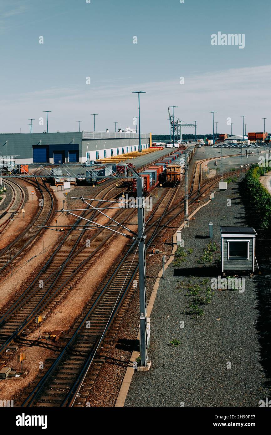 Top perspective view on freight trains on multiple railway track lines and yard switches in a rail yard Stock Photo