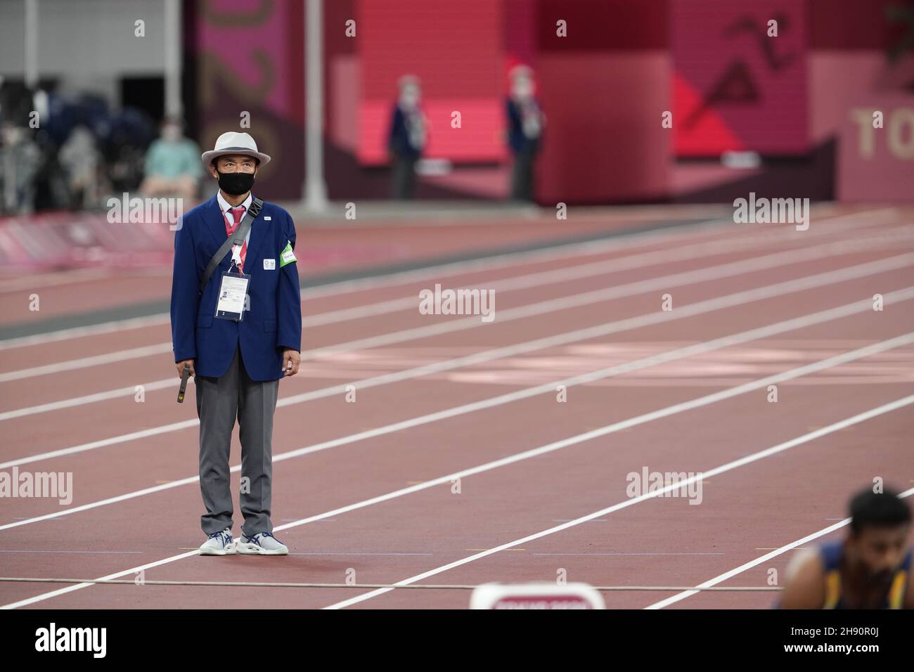 Athletics judge starting with the pistol at the Tokyo 2020 Olympic