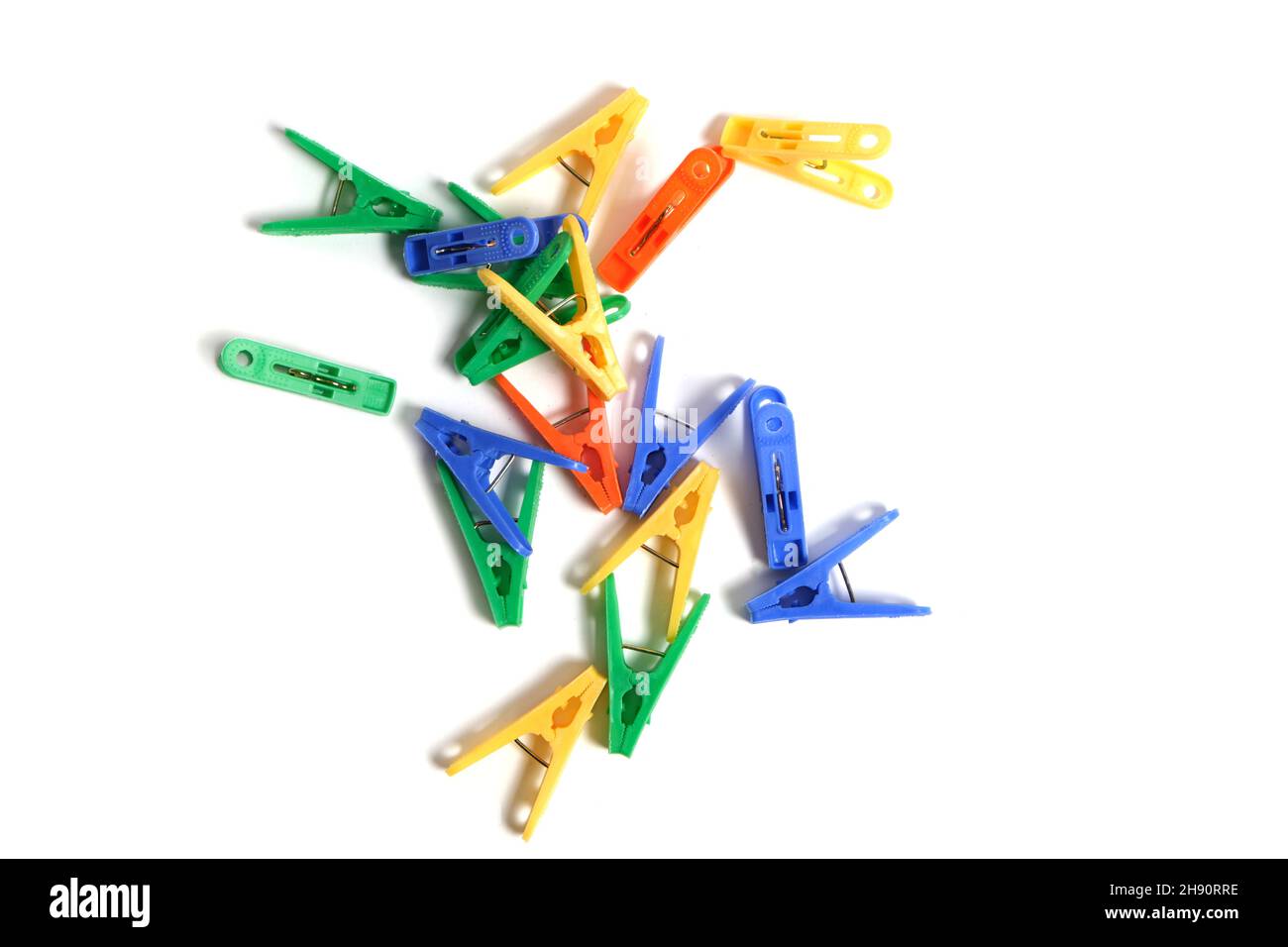 Multicolored clothespins on a white background, isolate Stock Photo