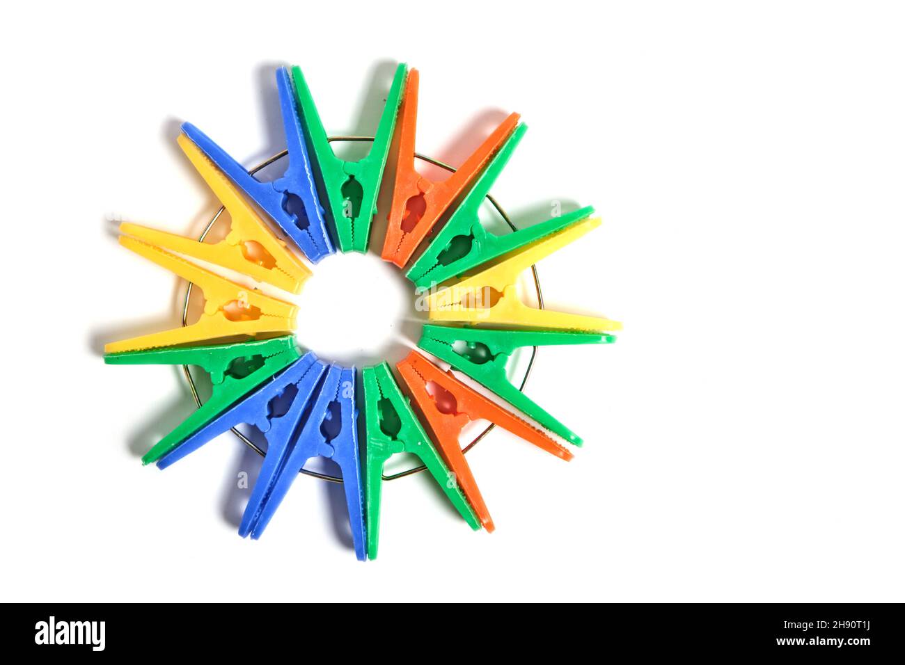 Multicolored clothespins on a white background, isolate Stock Photo