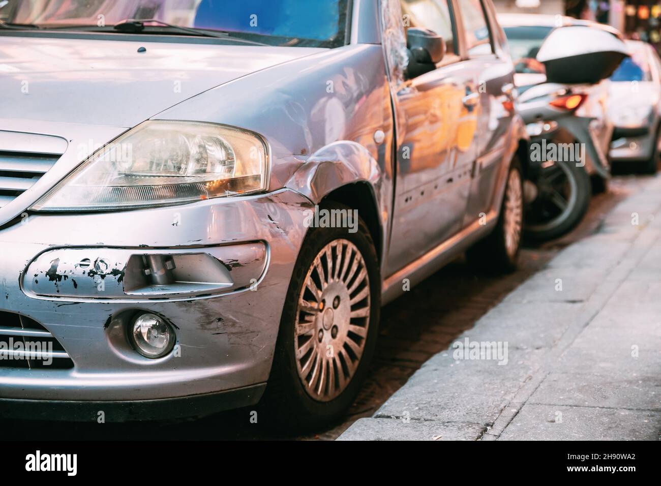 Broken Scratched Front Bumper And Fender Car. Scratched With Deep