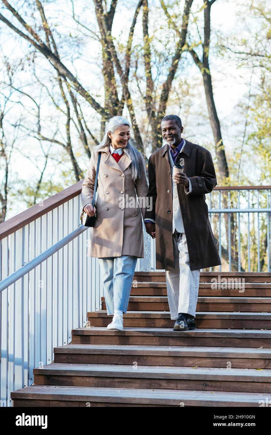 Storytelling image of a multiethnic senior couple in love. Stock Photo