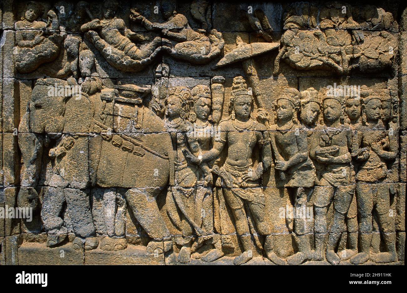 Borobudur or Barabudur is a Mahayana Buddhist temple from 7th century. Carved relief stone. Magelang, Java, Indonesia. Stock Photo
