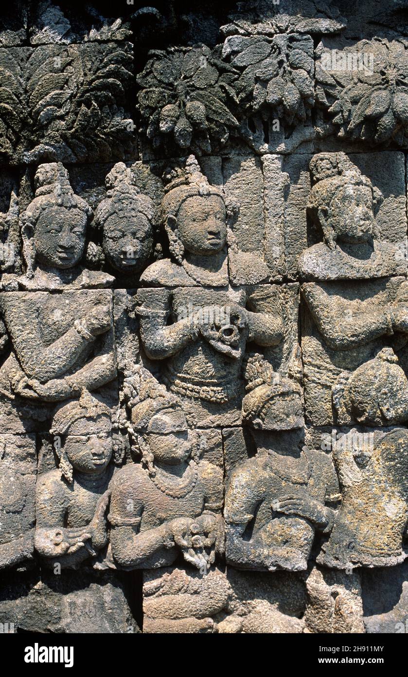 Borobudur or Barabudur is a Mahayana Buddhist temple from 7th century. Carved relief stone. Magelang, Java, Indonesia. Stock Photo
