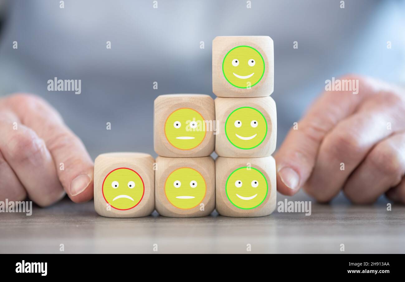 Customer service evaluation concept with wooden cubes Stock Photo - Alamy