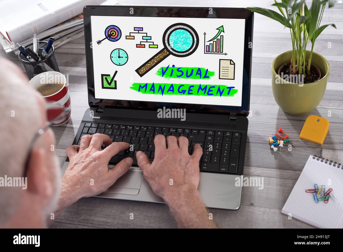 Visual management concept shown on a laptop used by a man Stock Photo ...