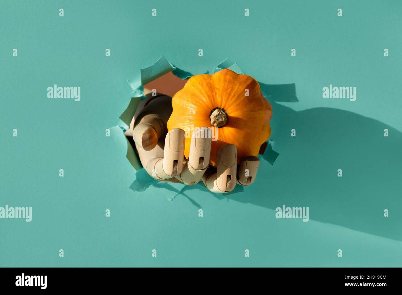 Hand through paper hi-res stock photography and images - Alamy