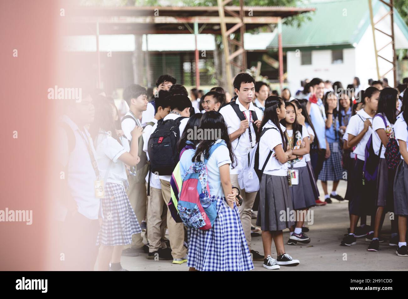 SCHOOL CHILDREN IN A FILIPINO SCHOOL WAITING FOR CLASS, PHILIPPINES - Jan 01, 2019: A view of the Filipino school children waiting for class to start Stock Photo
