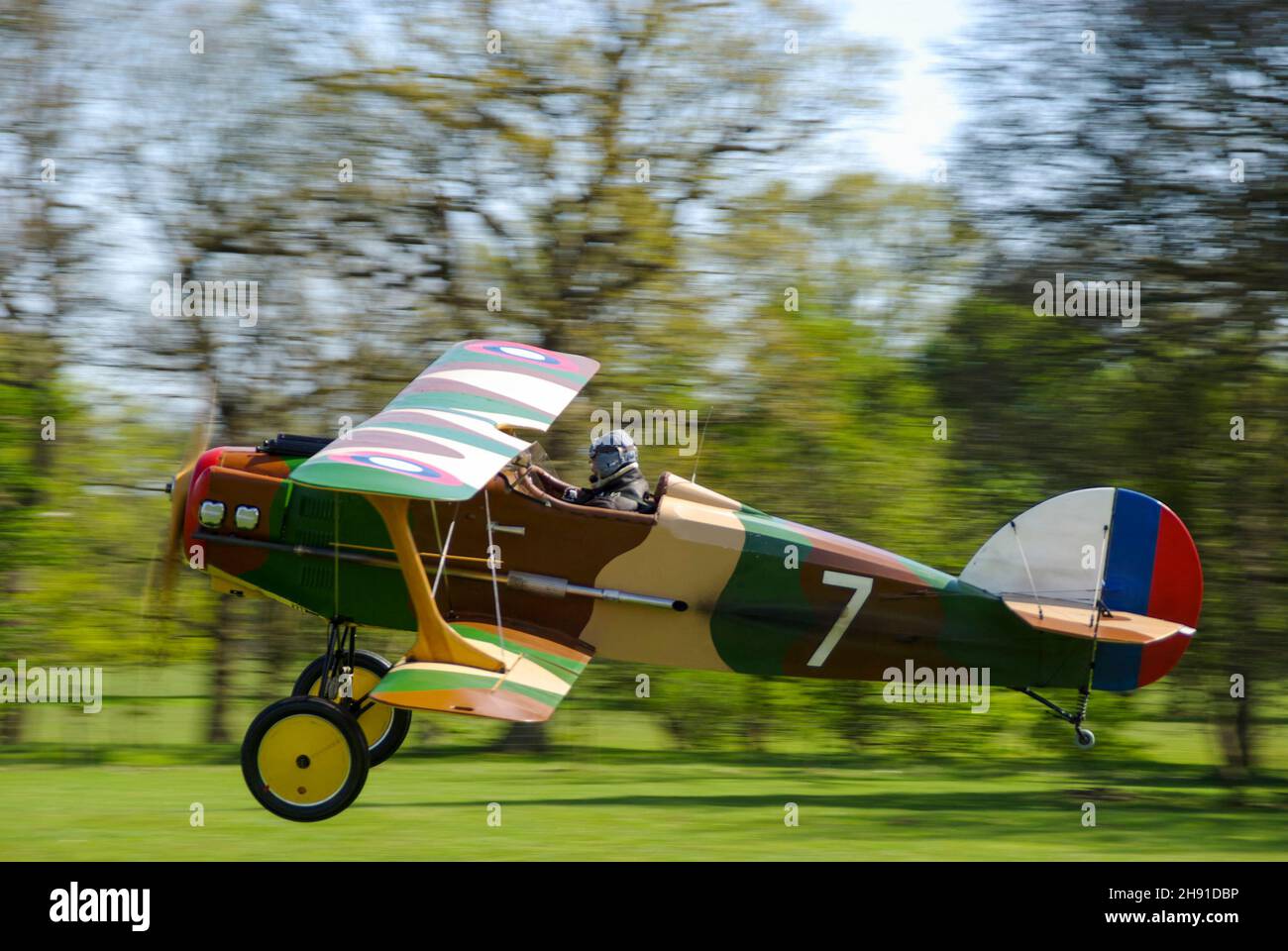 Wolf W-11 Boredom Fighter plane G-BMZK, a homebuilt light aircraft designed to resemble a first world war SPAD S.XIII biplane. Taking off from rural Stock Photo