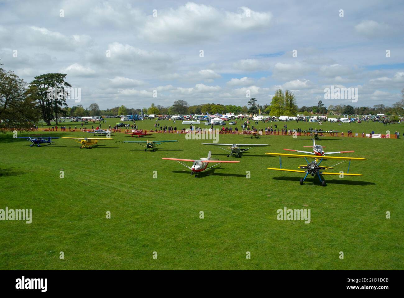 Event at Henham Park rural grass strip runway in Suffolk, UK. Henham Park Wings & Wheels Rally 2010 charity show by Halesworth Lions. Fly in planes Stock Photo