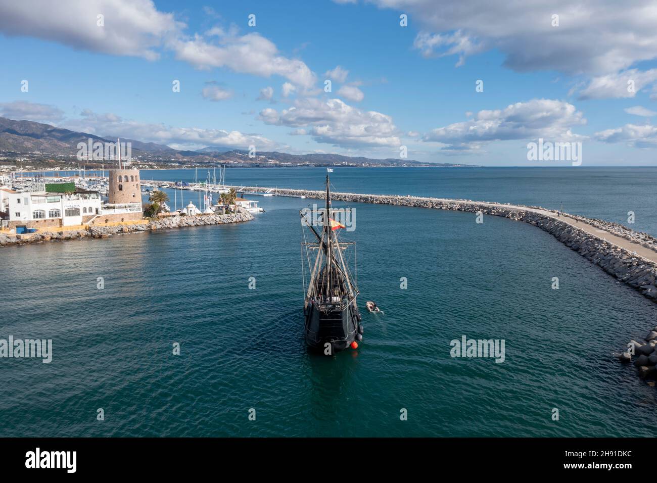 Nao Victory entering the mouth of the port of Banus, Marbella Stock Photo