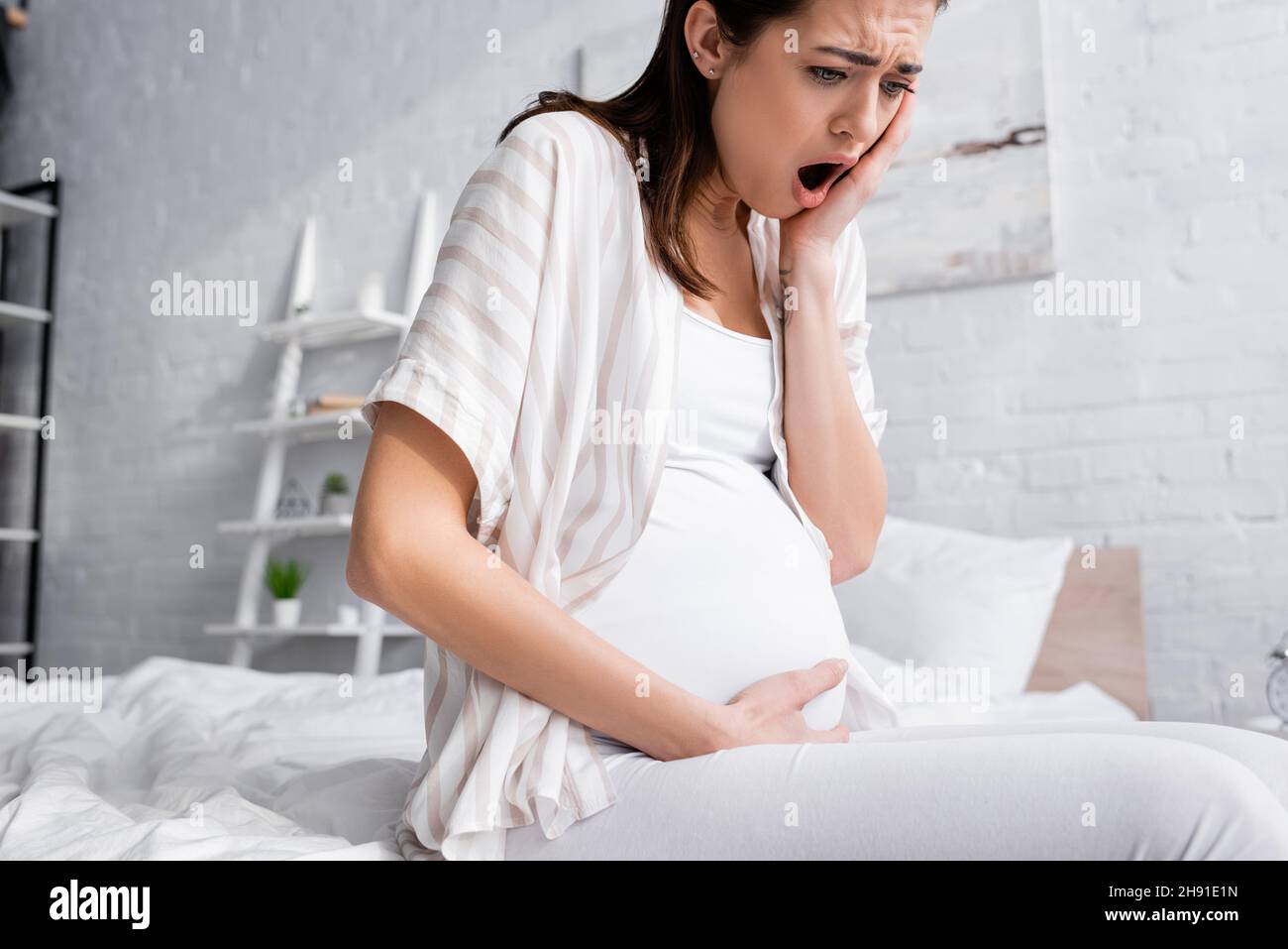 young pregnant woman suffering from cramp Stock Photo Alamy