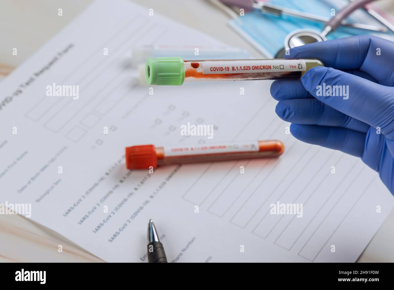 COVID-19 of B.1.1.529 new version Omicron epidemic virus outbreak Coronavirus infected blood test sample doctor hands. Stock Photo