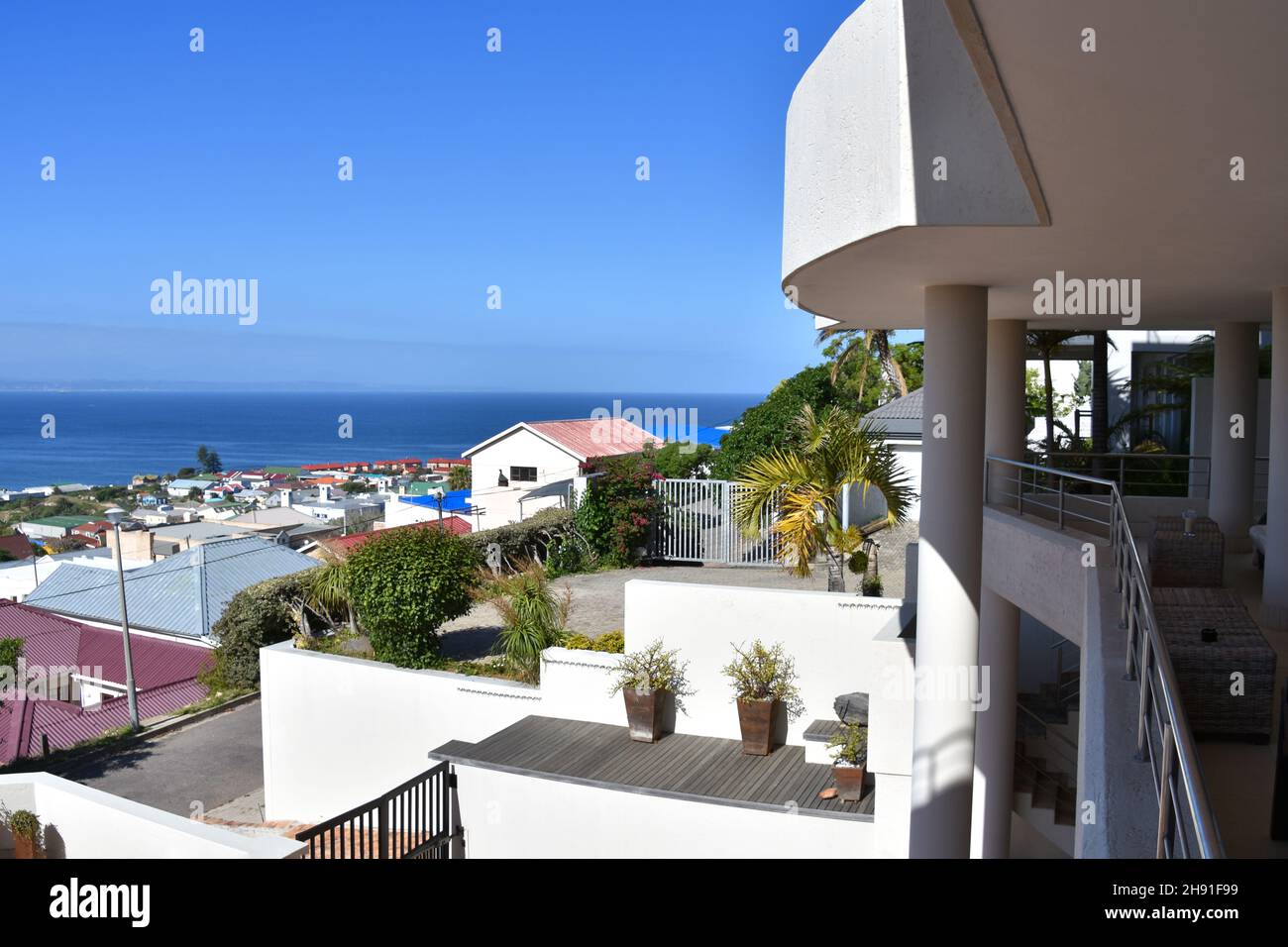 A view of the center of  Mosselbay on the Garden Route in South Africa with the water in the background on a sunny day Stock Photo