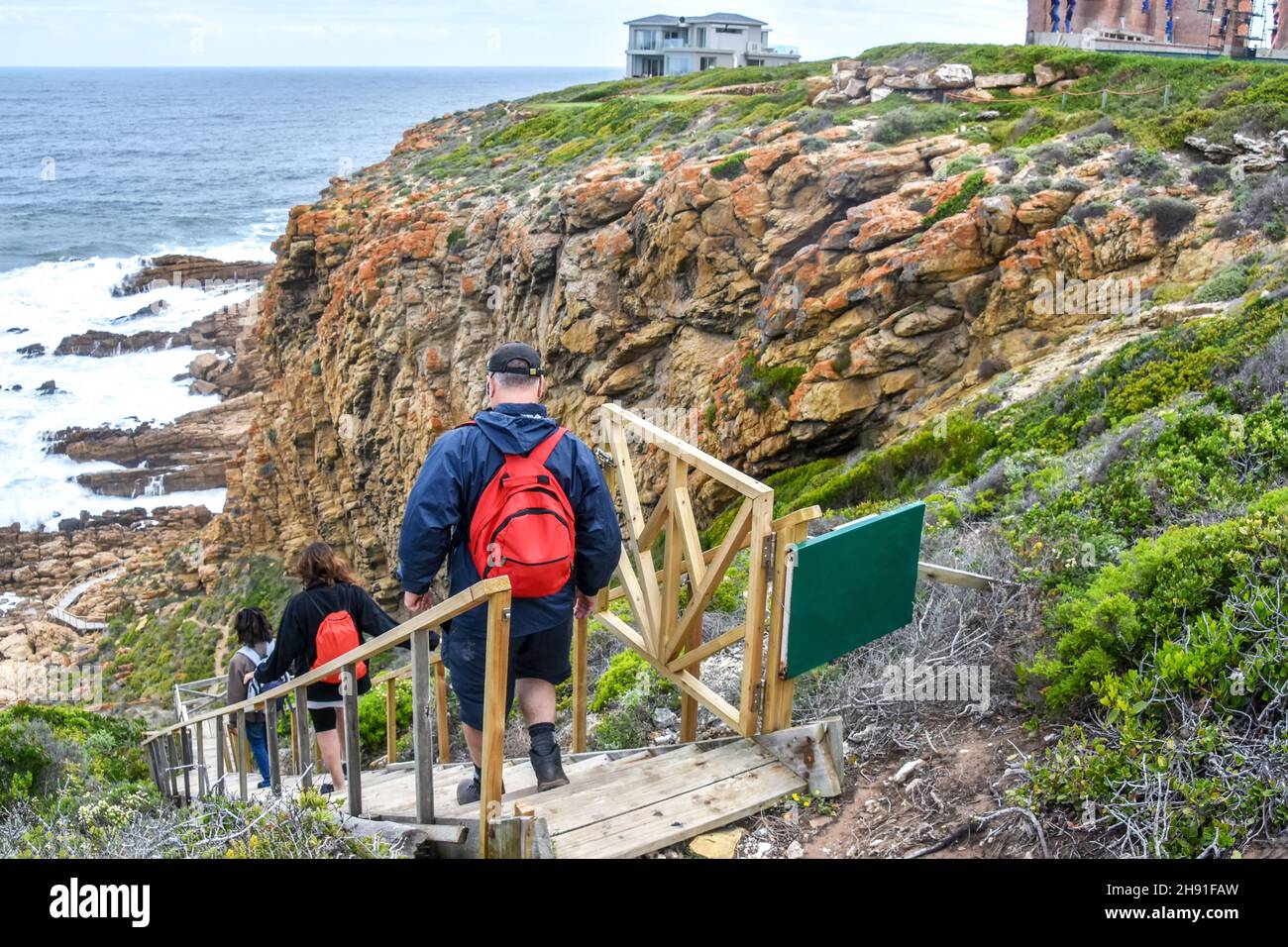 Steps to the caves at the Point of Human Origins near Mosselbay on the Garden Route in South Africa with tourists Stock Photo