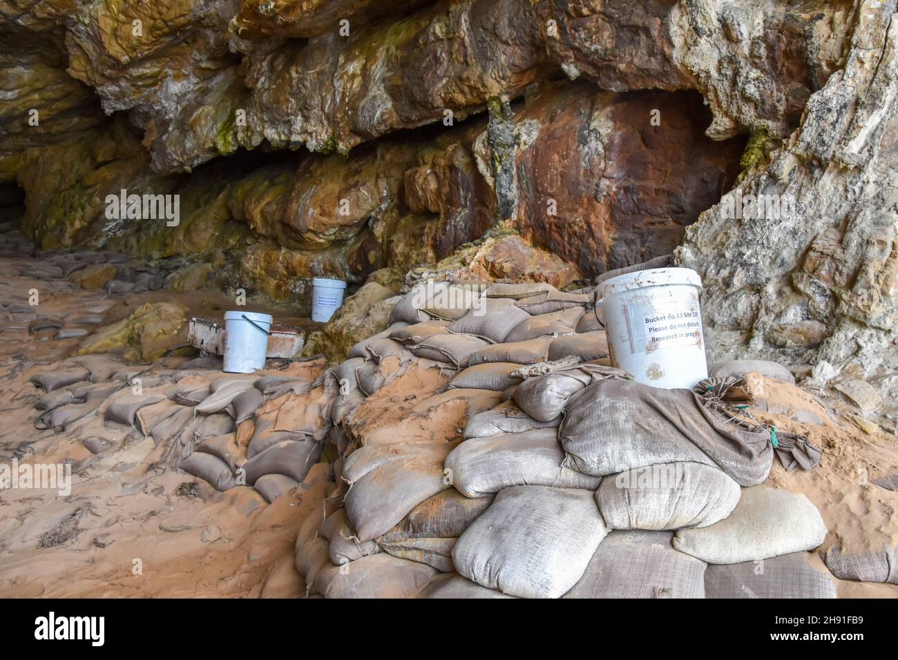 Water buckets at the Point of Human Origins near Mosselbay on the Garden Route in South Africa used to sample leakages from the above golf grounds Stock Photo