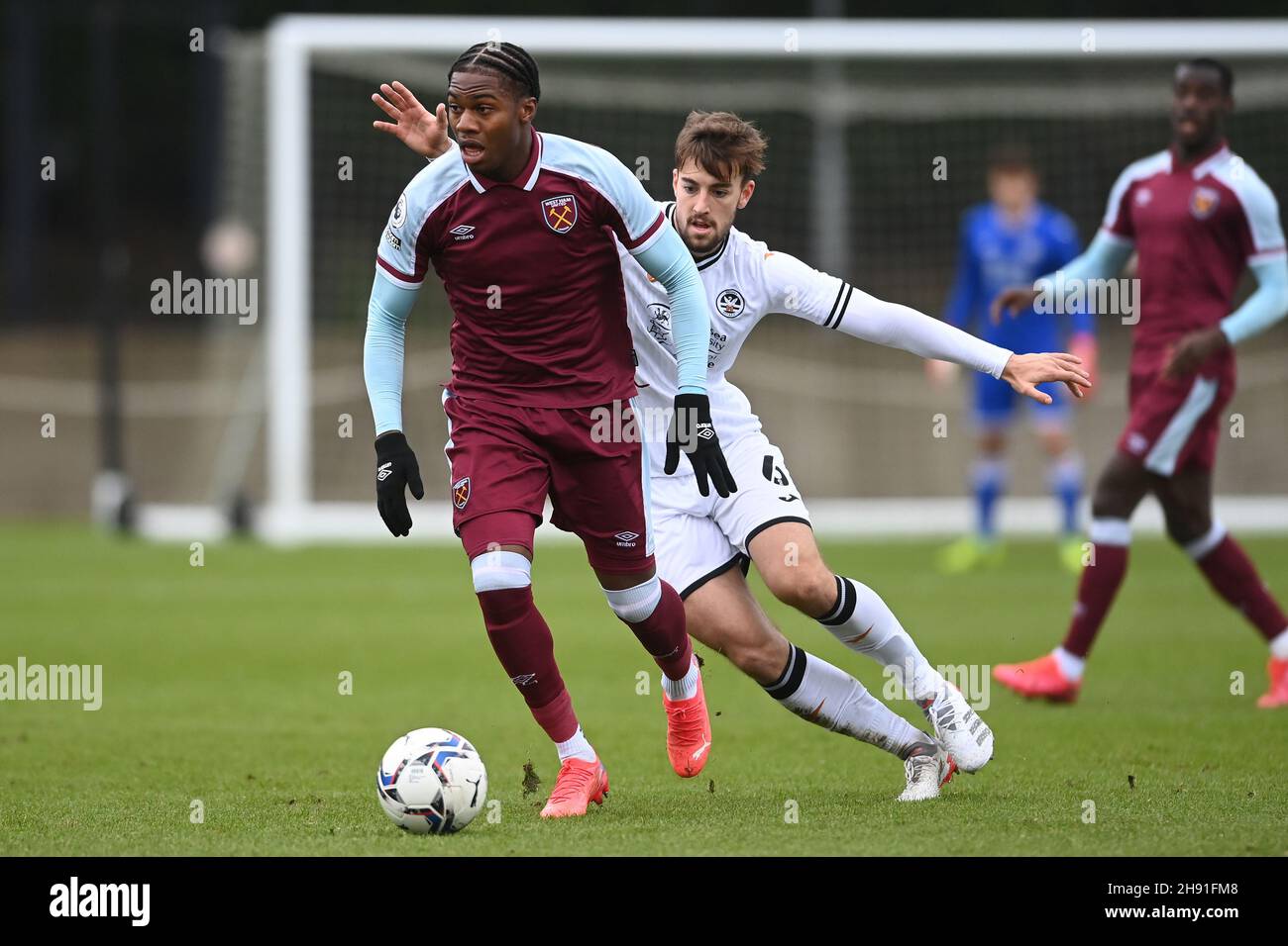 Thierry Nevers #11 of West Ham U23's under pressure from Ben Margetson #6 of Swansea City U23's Stock Photo